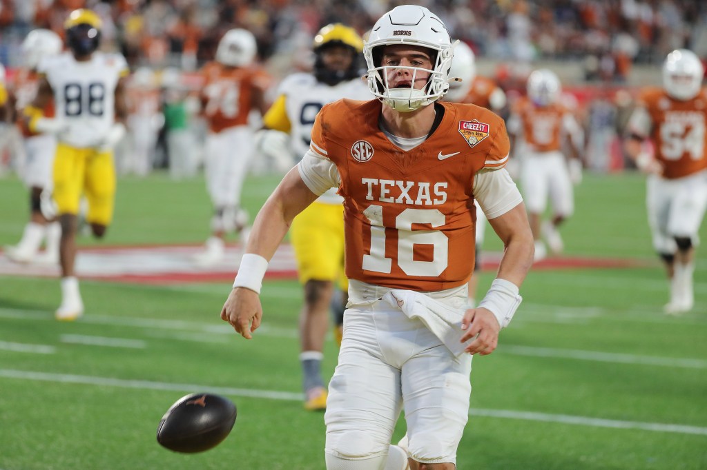 Texas quarterback Arch Manning (16) celebrates as he scores a rushing touchdown during the Cheez-It Citrus Bowl against Michigan at Camping World  Stadium on Dec. 31, 2025, in Orlando, Florida. 