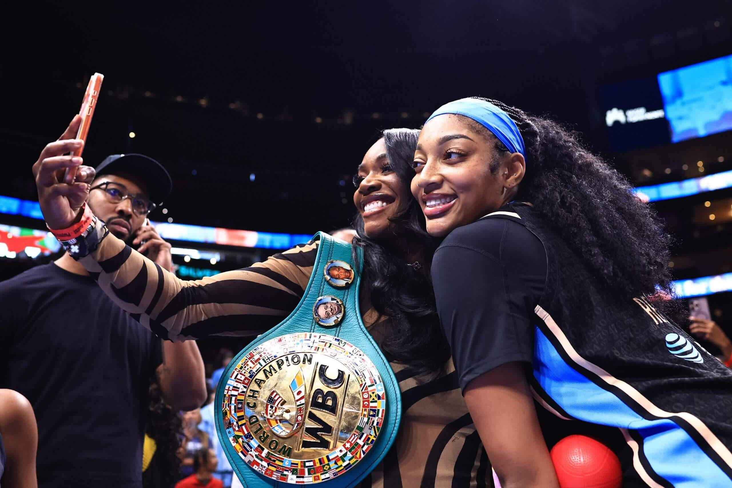 World boxing champion Claressa Shields takes a selfie with Angel Reese.