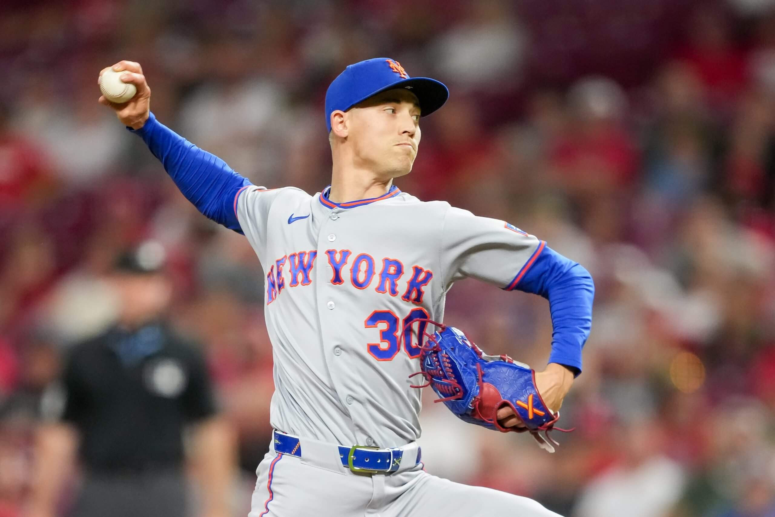 New York Mets pitcher Luke Weaver winds up to deliver a pitch.