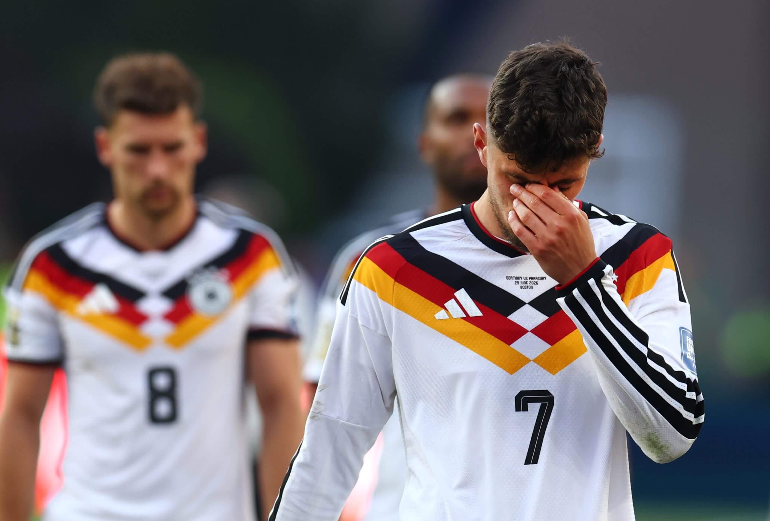 Kai Havertz holds his head after Germany's elimination