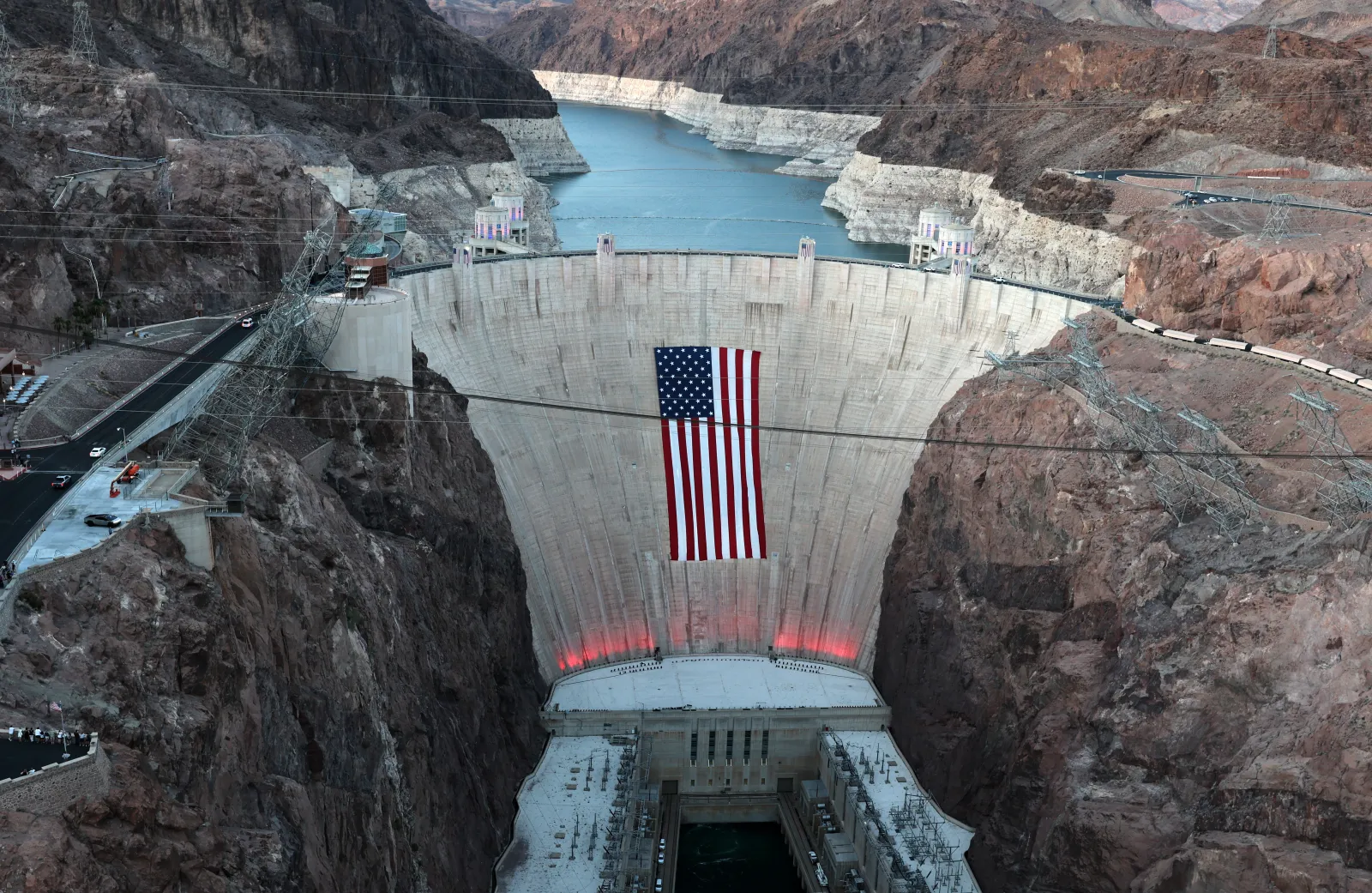 A 300-foot-by-150-foot American flag is suspended across the Hoover Dam on June 30, 2026, in the Lake Mead National Recreation Area on the Arizona-Nevada border.