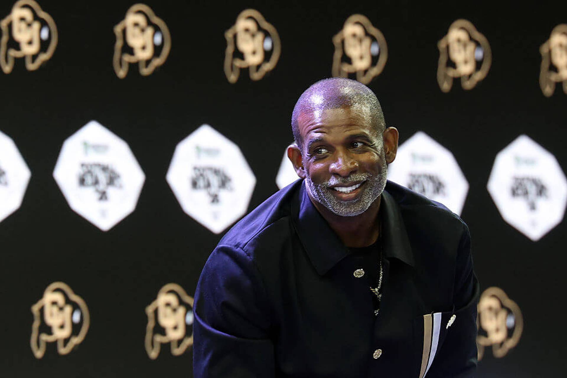 Deion Sanders speaks with the media at Big 12 media days Tuesday.