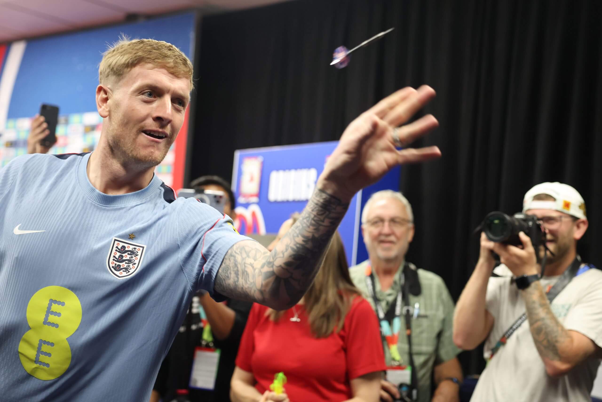 England goalkeeper Jordan Pickford throws a dart at England's training base as he and his team-mates play with members of the media