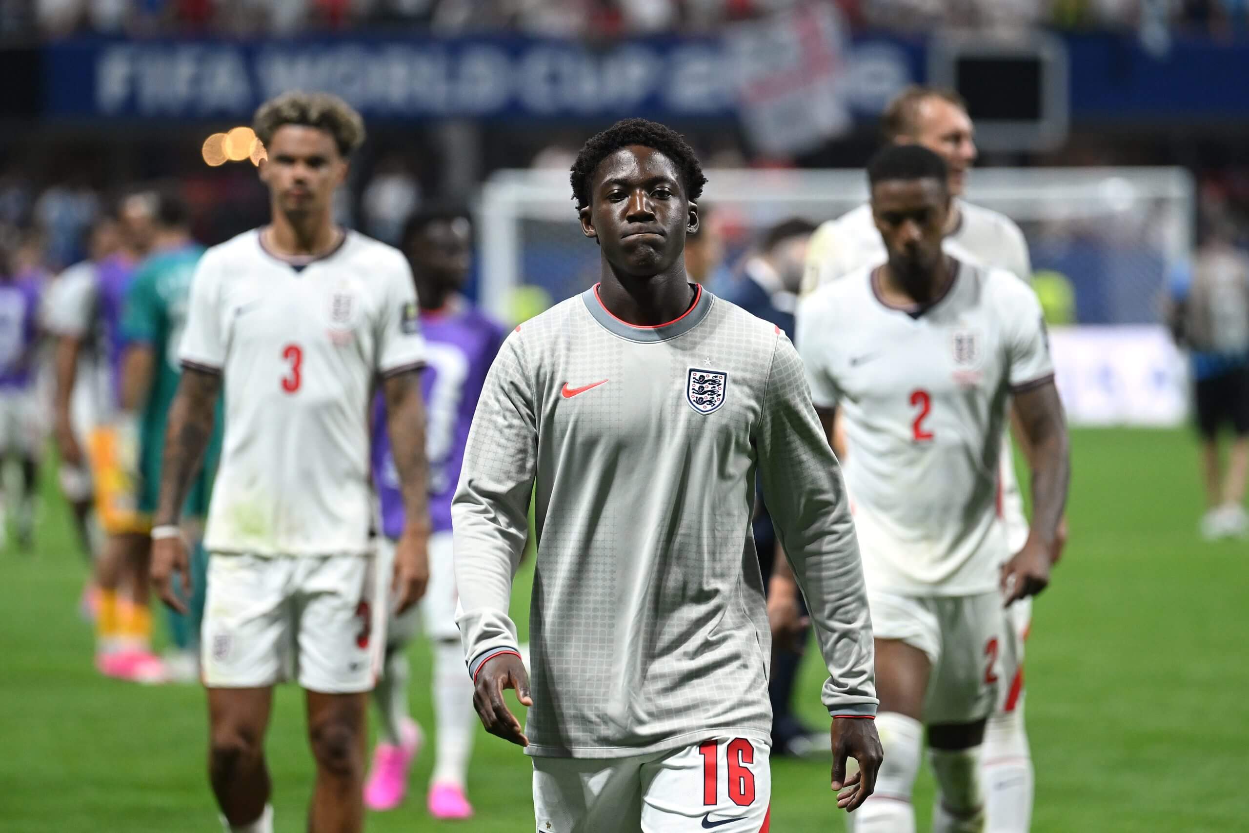 Unused substitute Kobbie Mainoo leaves the pitch with a forlorn expression following England's World Cup exit at the hands of Argentina