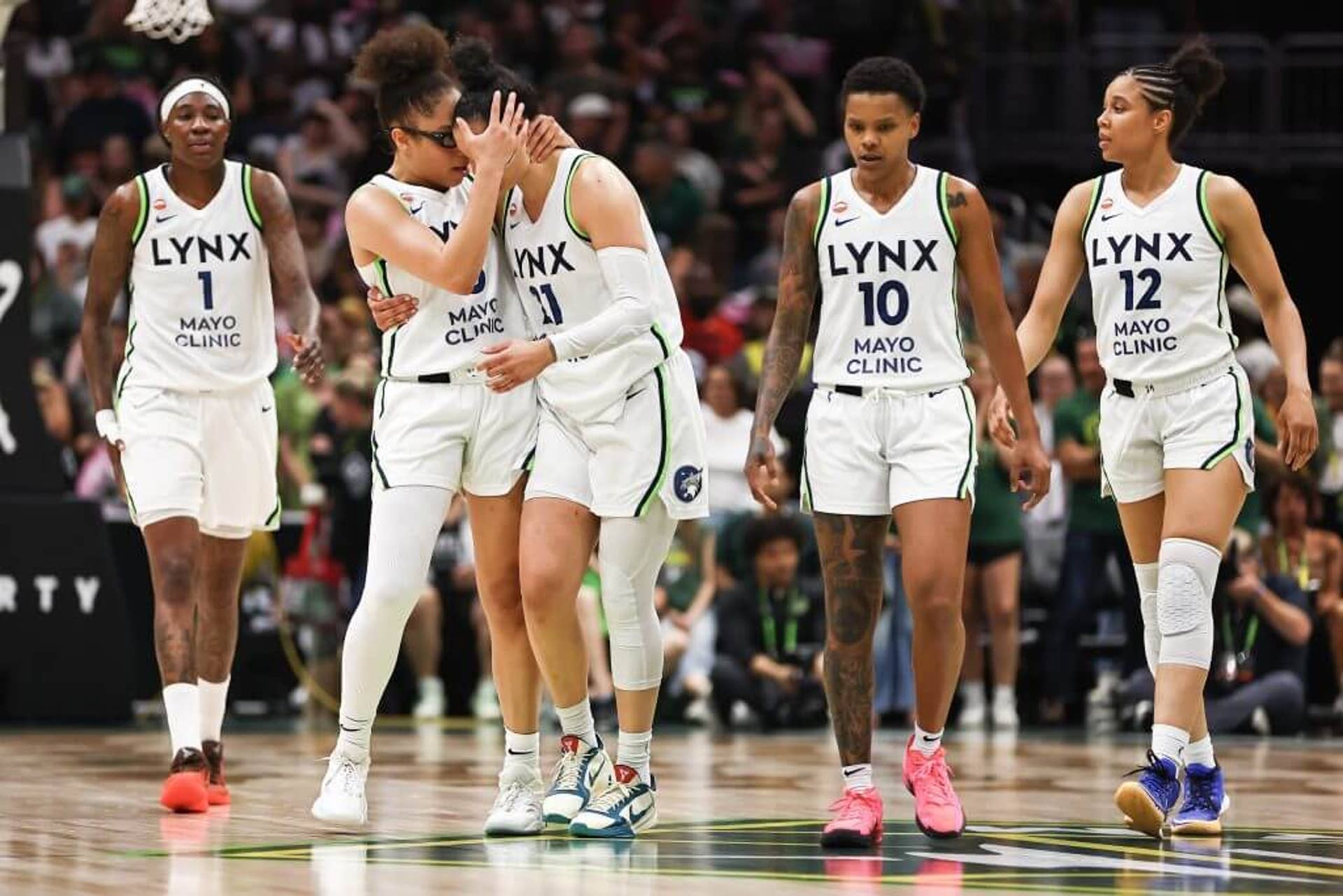Players walk alongside each other.