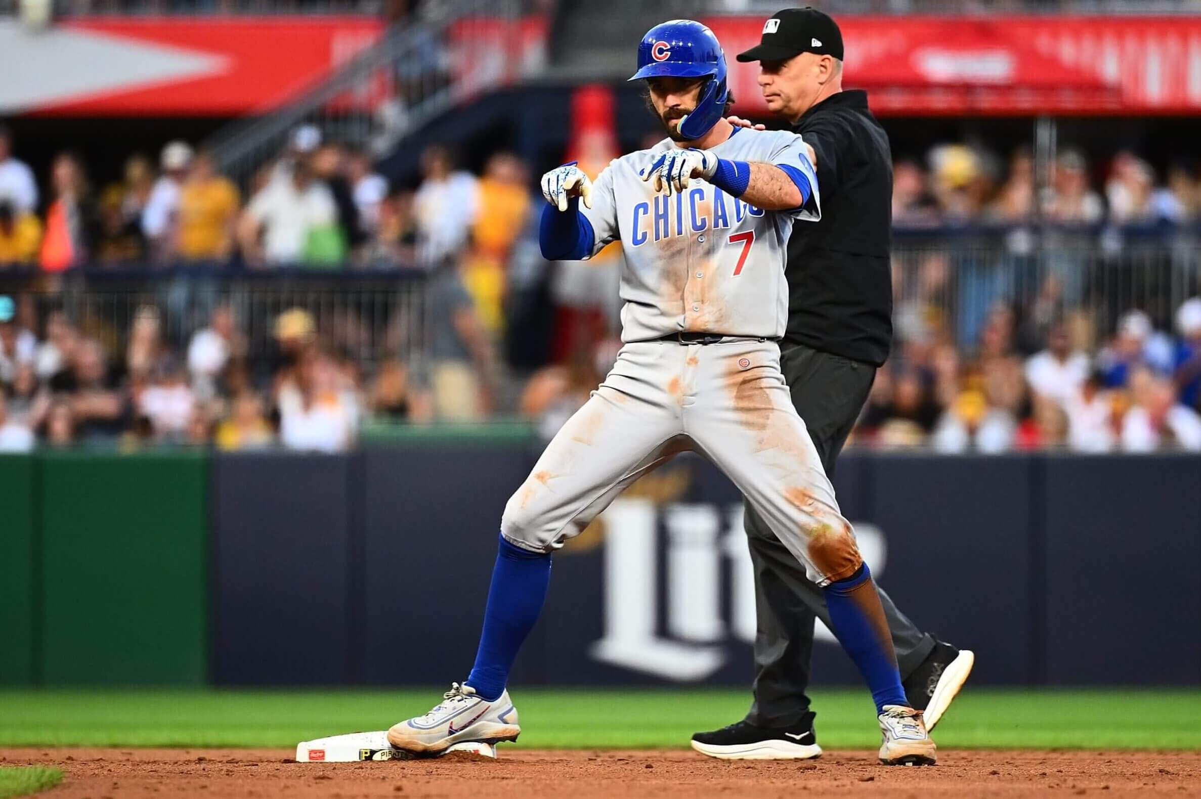 Cubs shortstop Dansby Swanson celebrates after hitting an RBI-double against the Pirates.