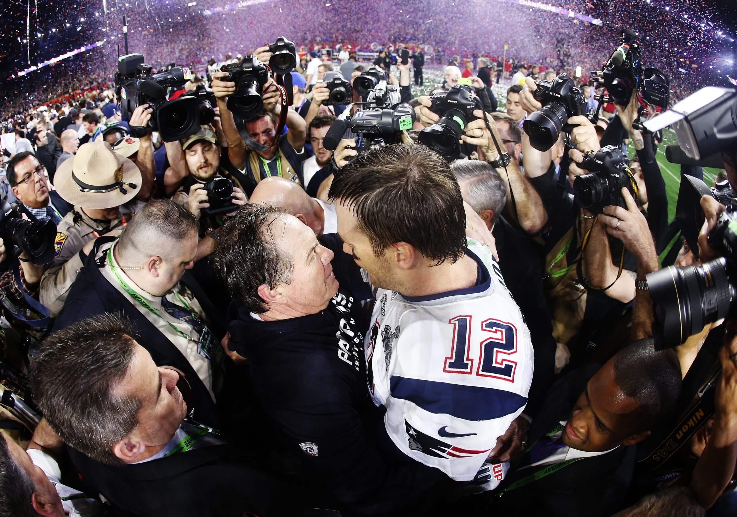Tom Brady of the New England Patriots celebrates with head coach Bill Belichick after defeating the Seattle Seahawks 28-24 during Super Bowl XLIX