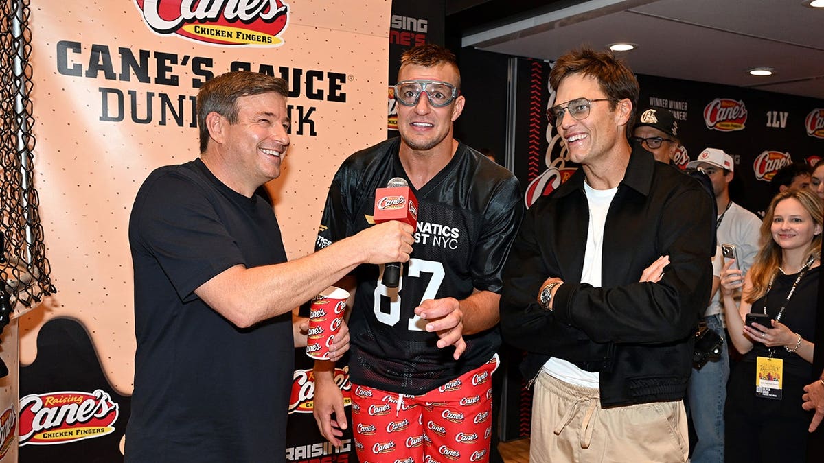 Todd Graves, Rob Gronkowski and Tom Brady stand together at Fanatics Fest NYC.
