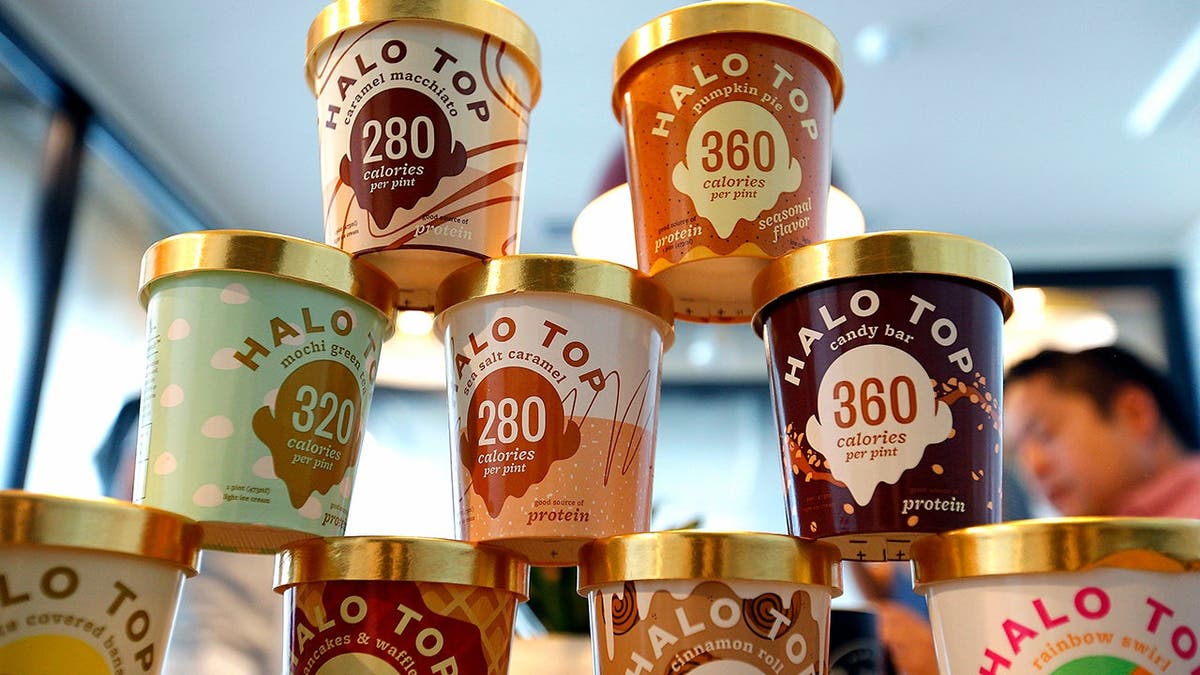 A stack of Halo Top ice cream tubs.