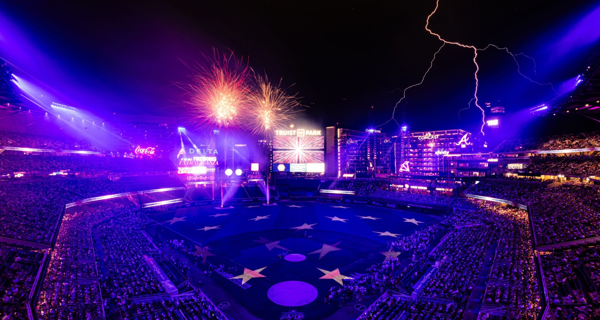 Timing fireworks photos is hard enough, but this sports photographer managed to get fireworks and lightning in one shot