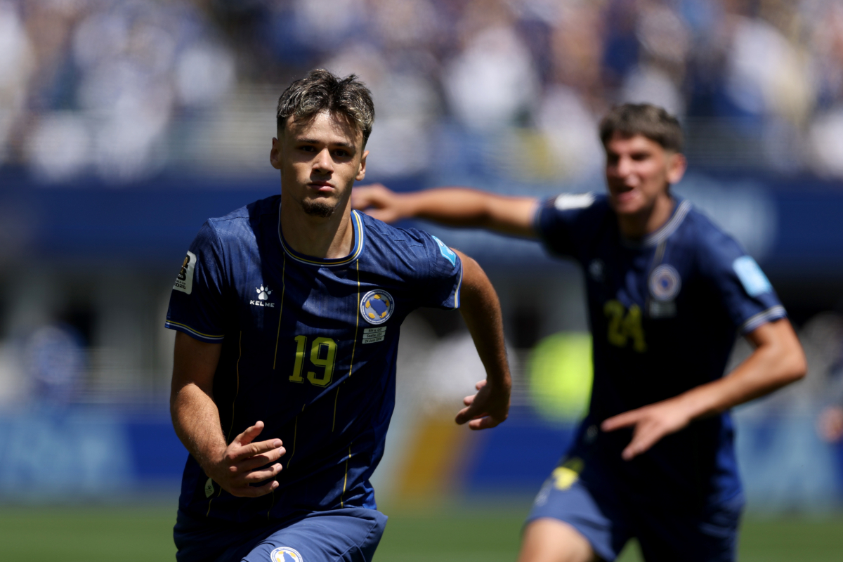SEATTLE, WASHINGTON - JUNE 24: Kerim Alajbegovic #19 of Bosnia and Herzegovina celebrates scoring his team's first goal during the FIFA World Cup 2026 Group B match between Bosnia and Herzegovina and Qatar at Seattle Stadium on June 24, 2026 in Seattle, Washington. (Photo by Stu Forster/Getty Images)