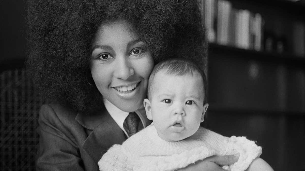 Marsha Hunt holding her baby Karis.