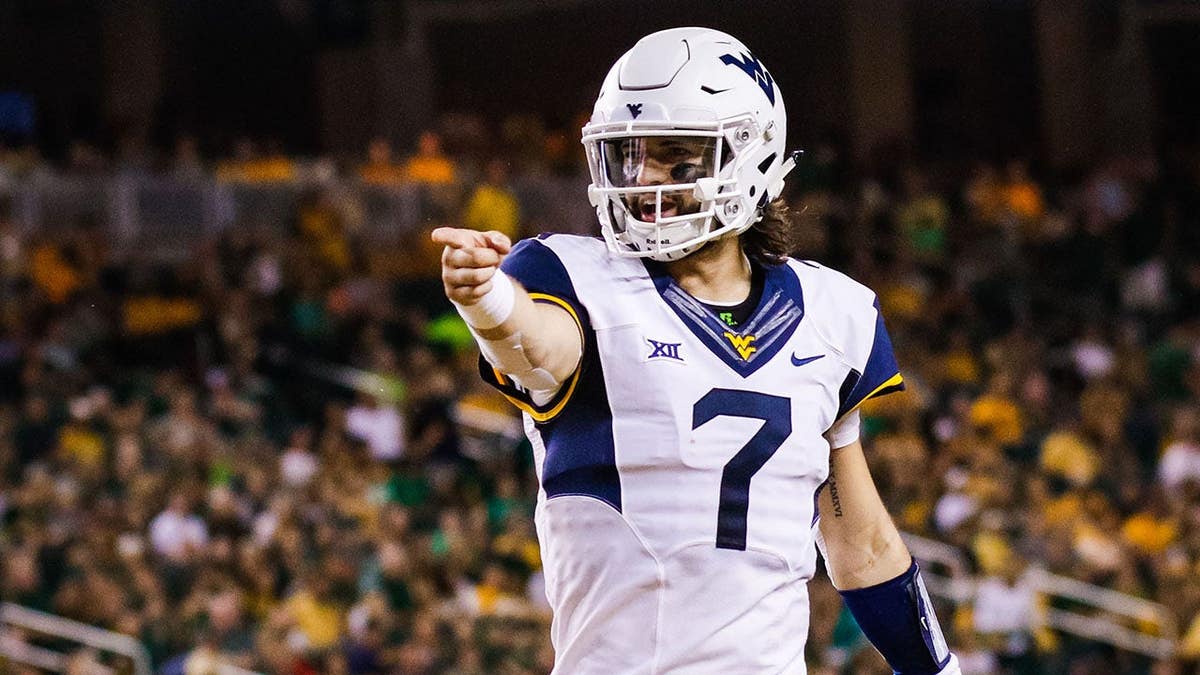 Will Grier reacts after throwing a touchdown pass at McLane Stadium.