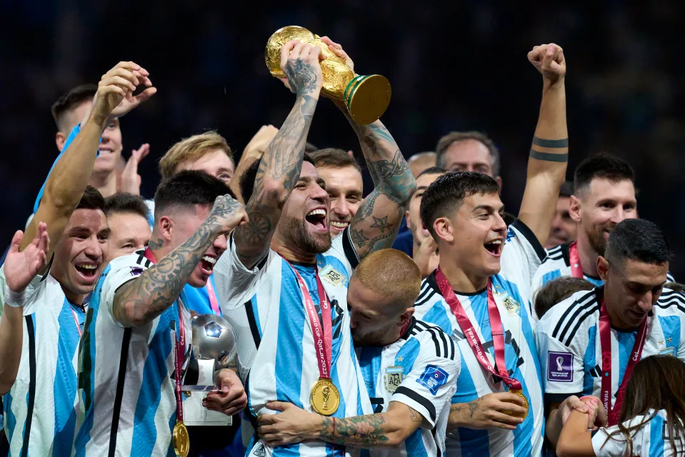 Nicolas Otamendi holds aloft World Cup trophy at 2022 final in Qatar