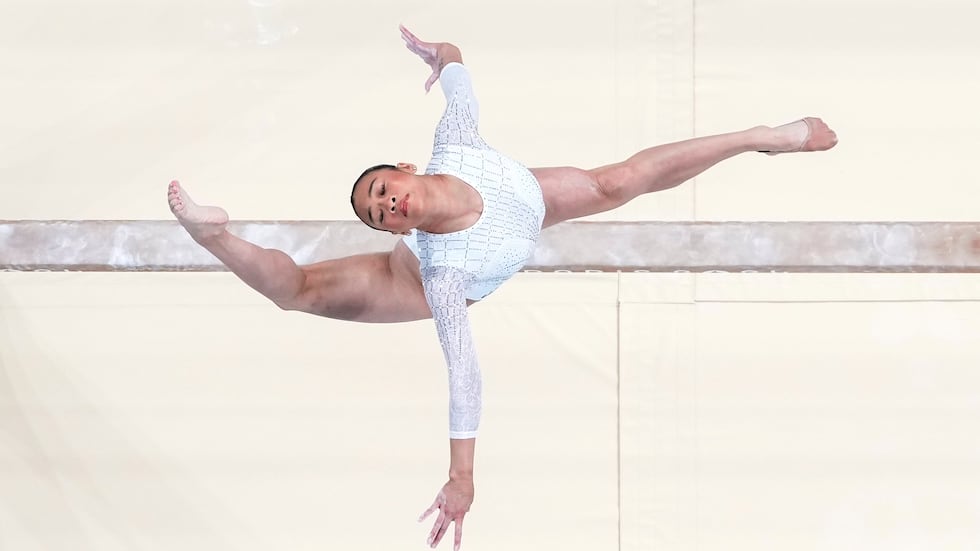 FILE - Suni Lee, of the United States, performs on the beam during the women's artistic...