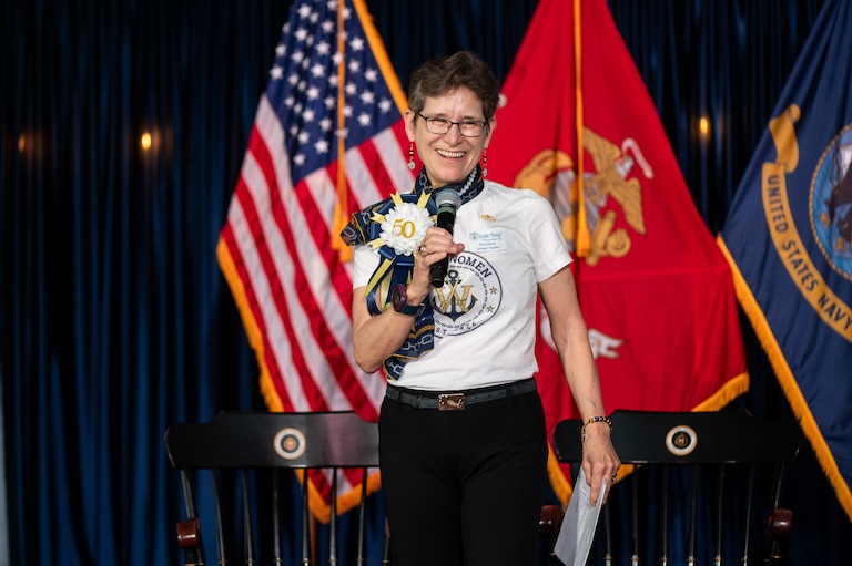 President of USNA Women Linda "Postie" Postenrieder welcomes alumni to the April gala celebrating the U.S Naval Academy's first co-ed class.