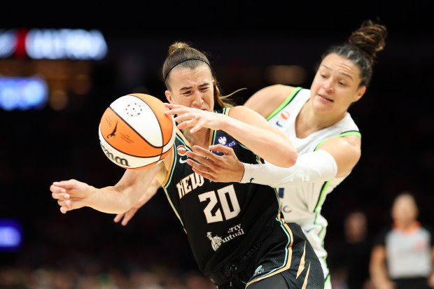 Sabrina Ionescu #20 of the New York Liberty draws a foul against Kayla McBride #21 of the Minnesota Lynx in the first quarter at Target Center on July 11, 2026 in Minneapolis, Minnesota. (Photo by David Berding/Getty Images)