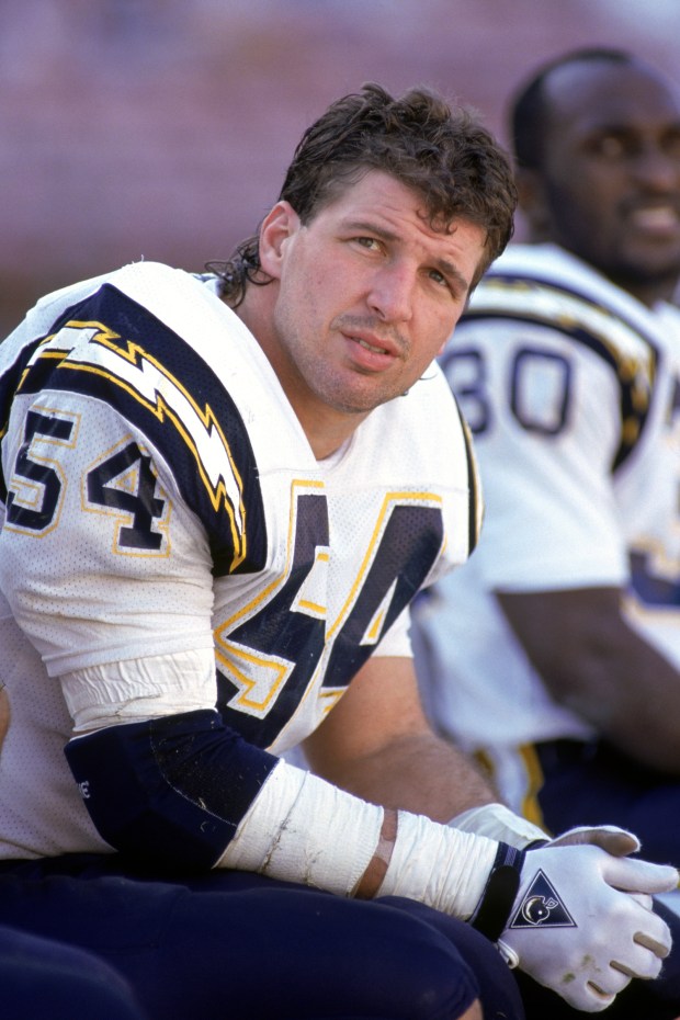 SAN DIEGO - DECEMBER 2: Linebacker Billy Ray Smith #54 of the San Diego Chargers watches the action from the sidelines during a game against the New York Jets at Jack Murphy Stadium on December 2, 1990 in San Diego, California. The Chargers won 38-17. (Photo by George Rose/Getty Images)