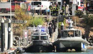 Emergency crews gather at a dock near the site of a pontoon boat fire on Tuesday, July 14, 2026, in San Francisco. (AP Photo/Noah Berger)