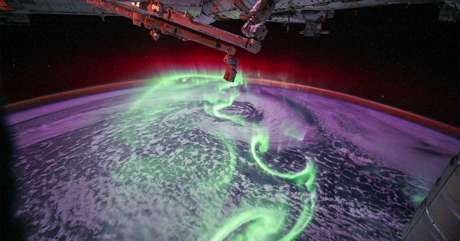 Astronaut Captures Dazzling Aurora Dancing Above Earth