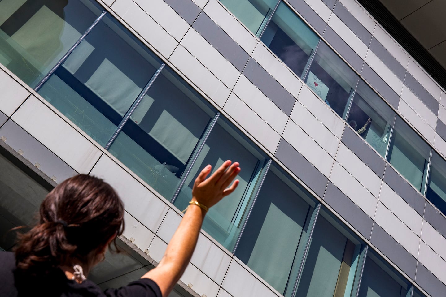 A patient waved toward nurses during the nurses' strike outside Brigham and Women's Hospital Wednesday.