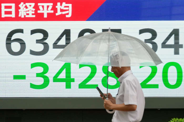 Asian shares sink, with Tokyo down more than 5% as slumping AI stocks drag world markets lower