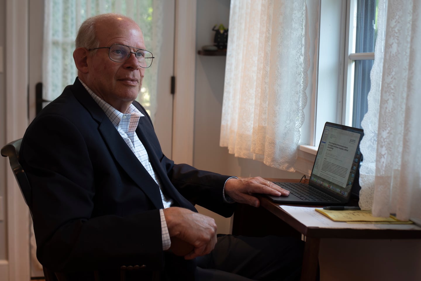 Dr. Michael Jellinek, 77, sits inside his psychiatry office. Jellinek has held high-ranking positions at Mass General Brigham and wrote a commentary for a peer-reviewed journal criticizing how the state's largest health care company merged clinical operations at its two flagship hospitals starting in 2024.
