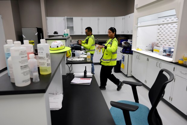 Workers test water samples on June 10 at the Prospect Lake Clean Water Center in Fort Lauderdale. (Amy Beth Bennett/South Florida Sun Sentinel)