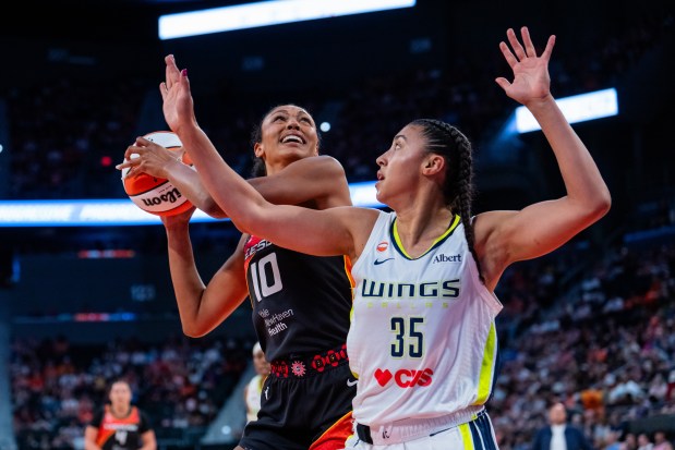 Former UConn stars Olivia Nelson-Ododa, left, of the Connecticut Sun, and Azzi Fudd of the Dallas Wings go head-to-head during Thursday night's WNBA game at PeoplesBank Arena in Hartford. (Joe Buglewicz/Getty Images)
