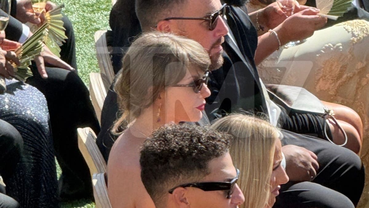 Taylor Swift wears sunglasses as she sits beside Travis Kelce and Patrick and Brittany Mahomes