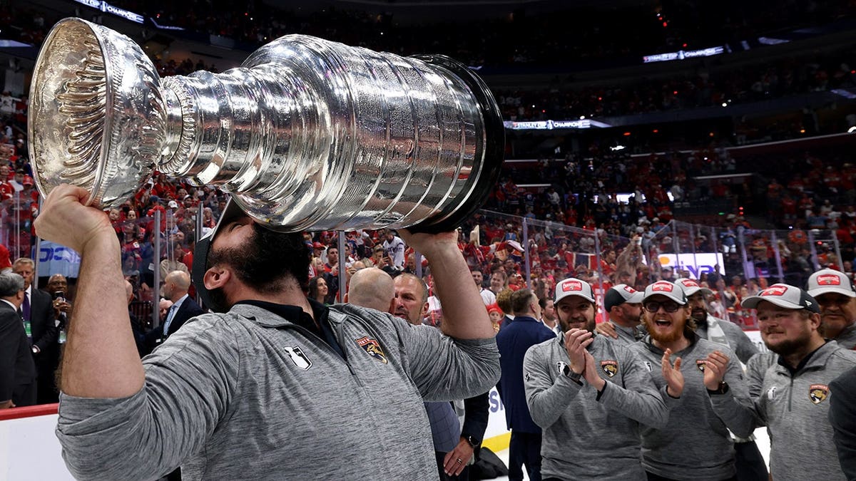 Teddy Richards celebrates with the Stanley Cup at Amerant Bank Arena.