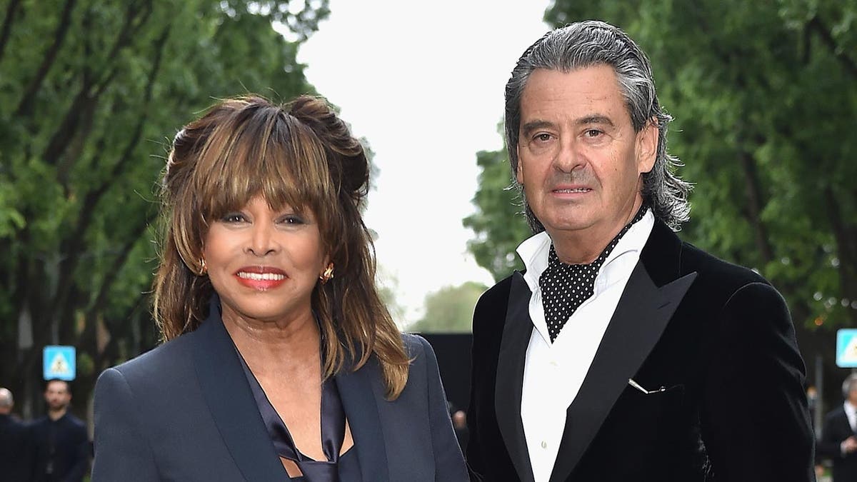 Tina Turner and her husband Erwin Bach standing together at an event.