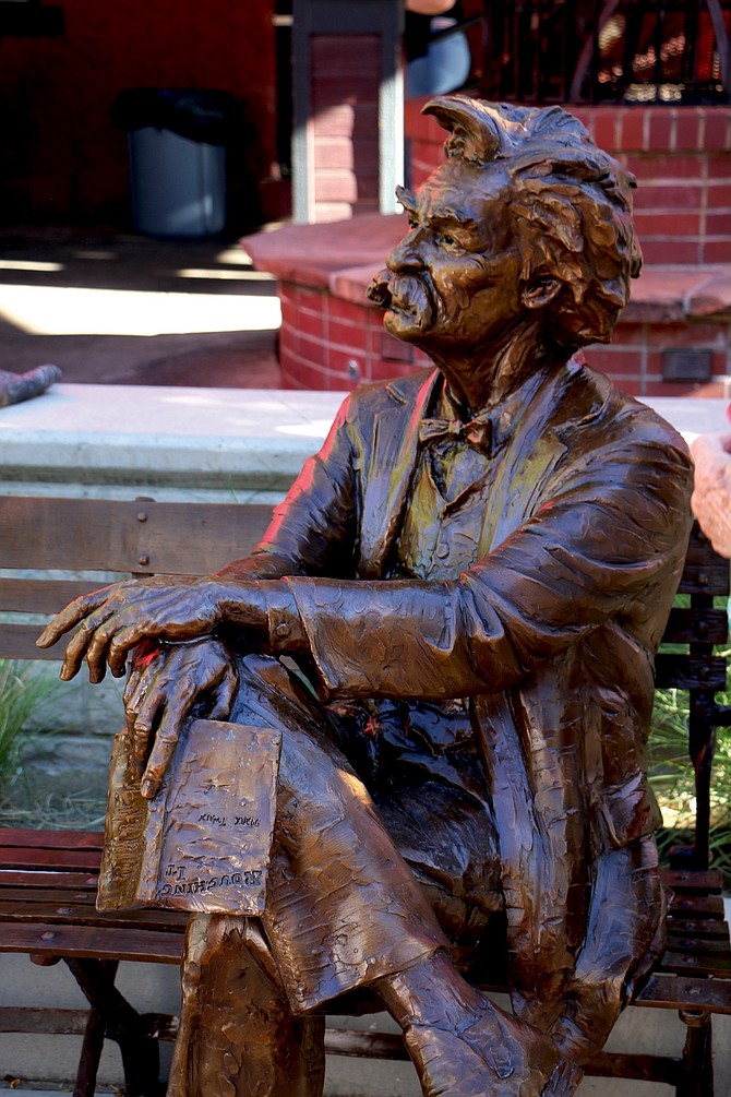 Carson City officials, Visit Carson City and representatives of the Never Sweats literary society unveil a bronze statue of Mark Twain in McFadden Plaza on July 24, 2026.