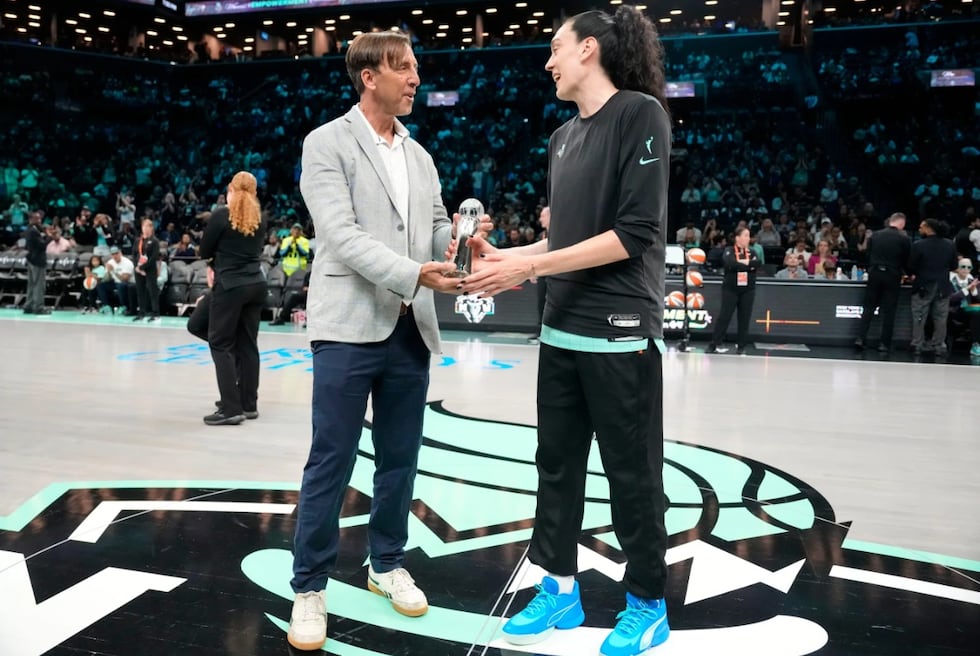 The Associated Press'' Global Sports Editor Josh Hoffner presents the Greatest Player award to...