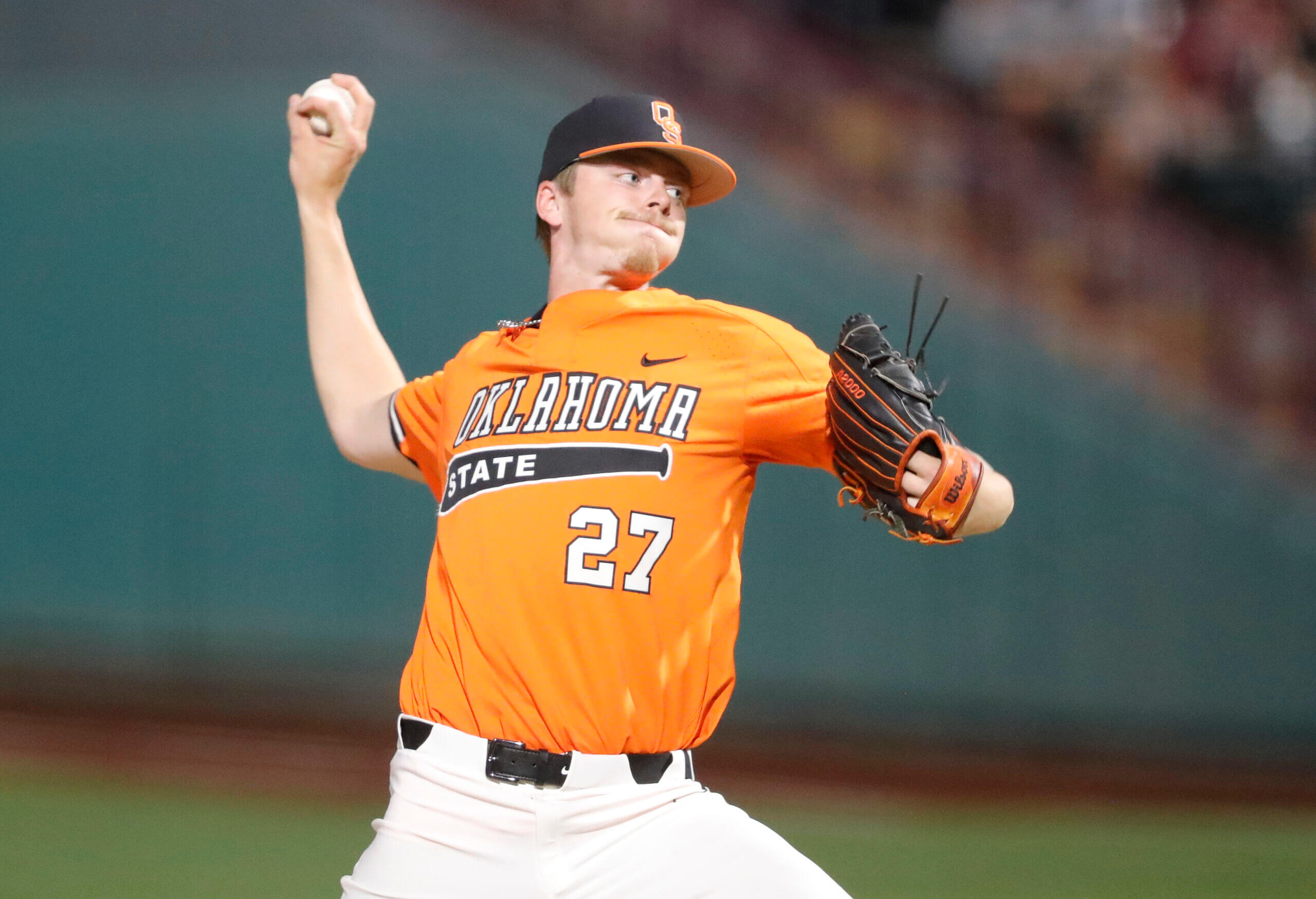 Oklahoma St. pitcher Justin Campbell (27) delivers a pitch to Oklahoma during the Big 12 Conference Baseball Tournament at Chickasaw Bricktown Ballpark. 