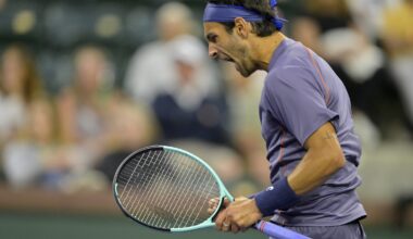 Lorenzo Musetti celebrates winning a set against Arthur Fils at the BNP Paribas Open in Indian Wells in 2025.