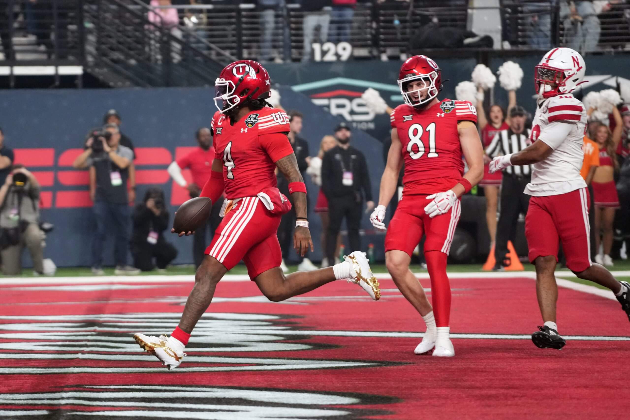 Devon Dampier runs the ball into the endzone.