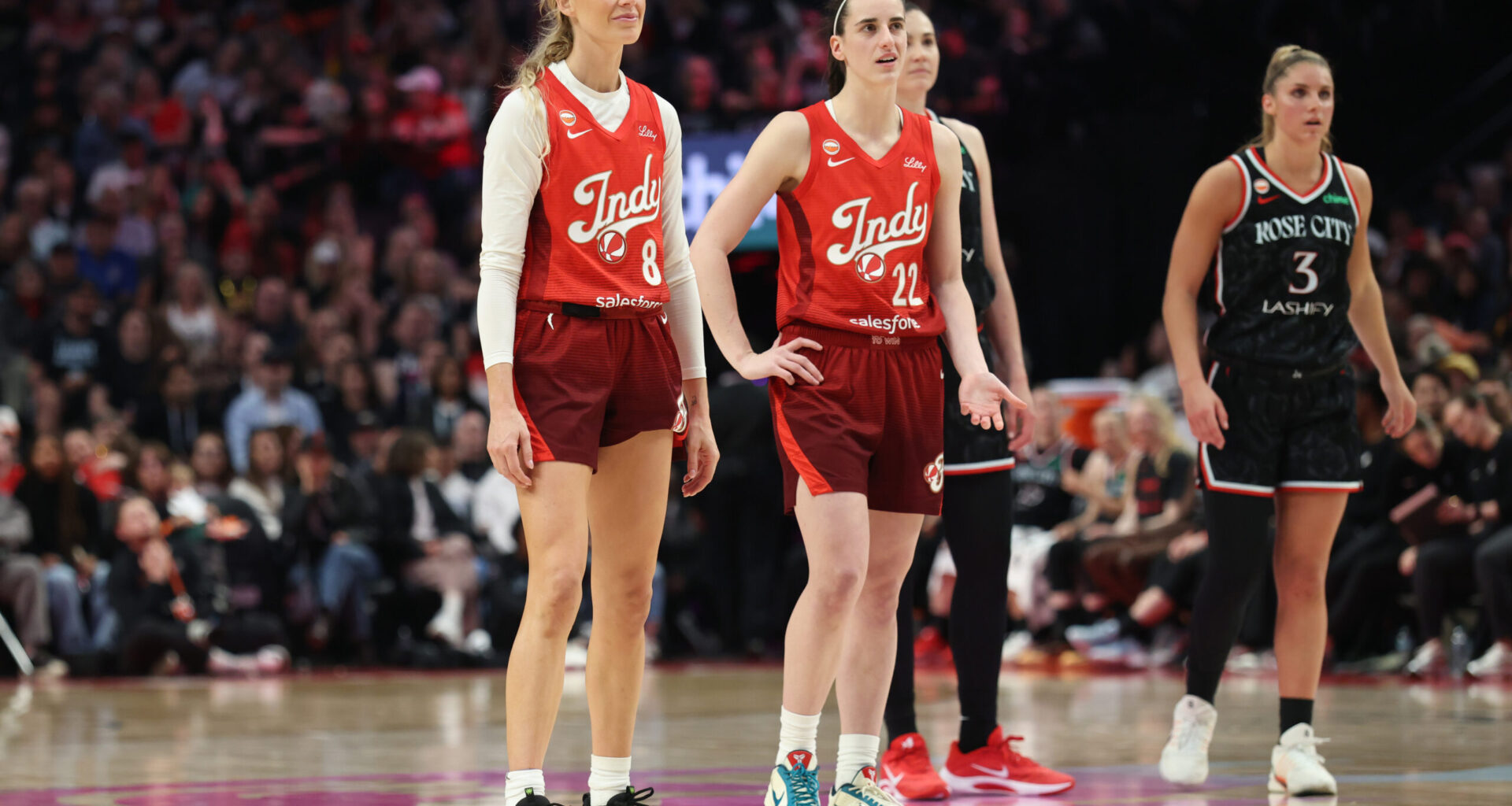 May 30, 2026; Portland, Oregon, USA; Indiana Fever guard Sophie Cunningham (8) and guard Caitlin Clark (22) stand next to each other during the second half against the Portland Fire at Moda Center. Mandatory Credit: Jaime Valdez-Imagn Images