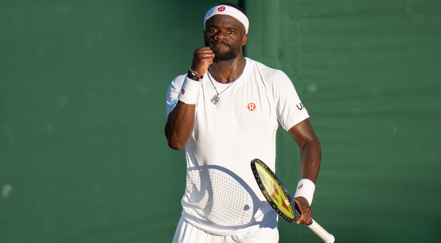 Frances Tiafoe celebrates a point at Wimbledon in 2026.