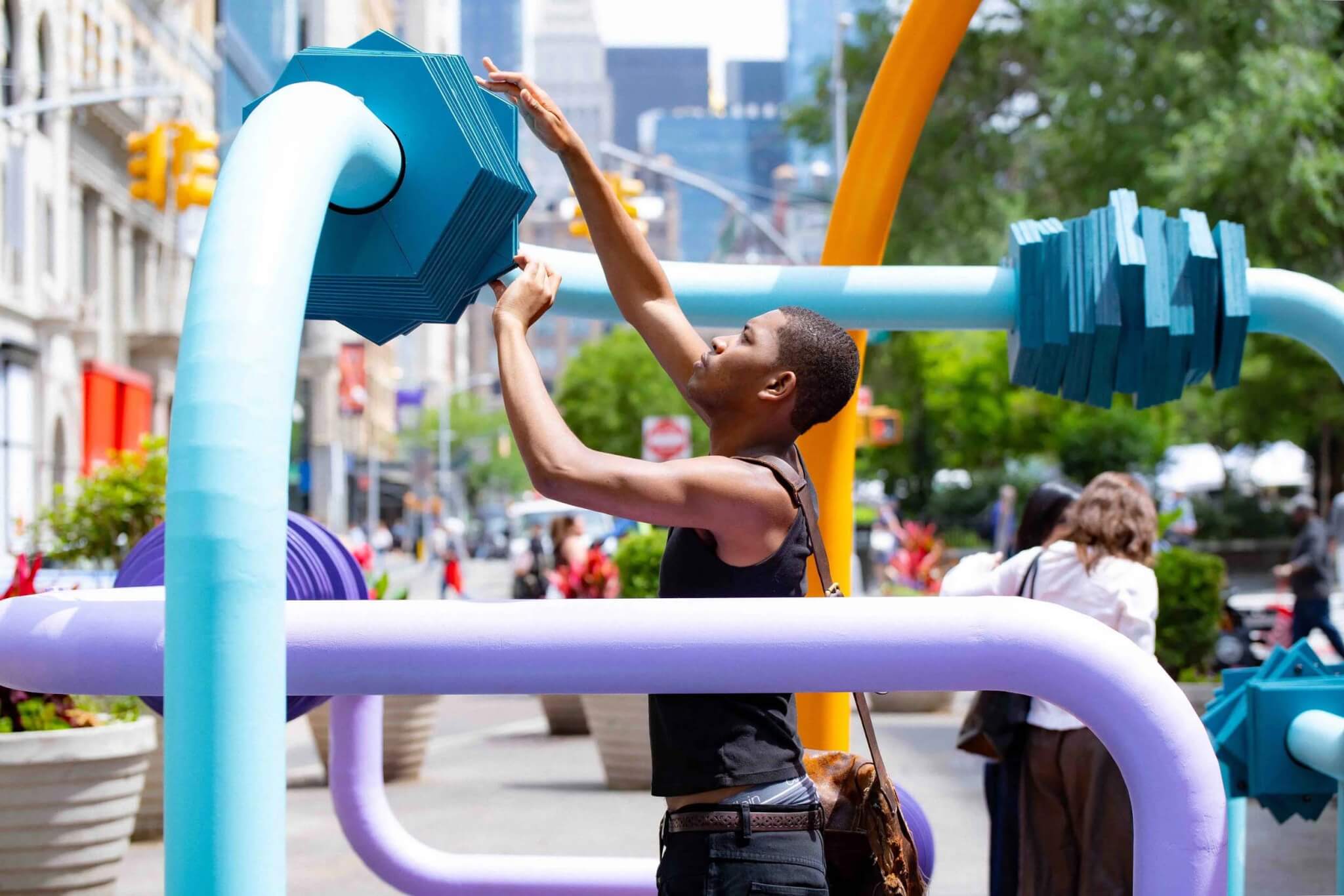 person interacting with bead maze 