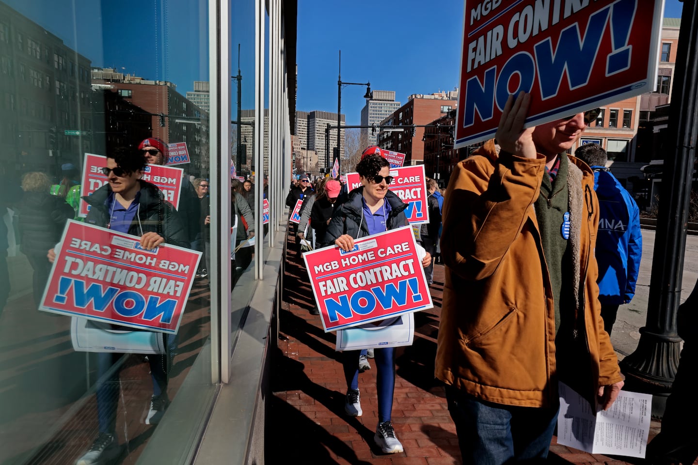 Clinicians with MGB Home Care and their supporters picketed outside Massachusetts General Hospital in Boston in March.