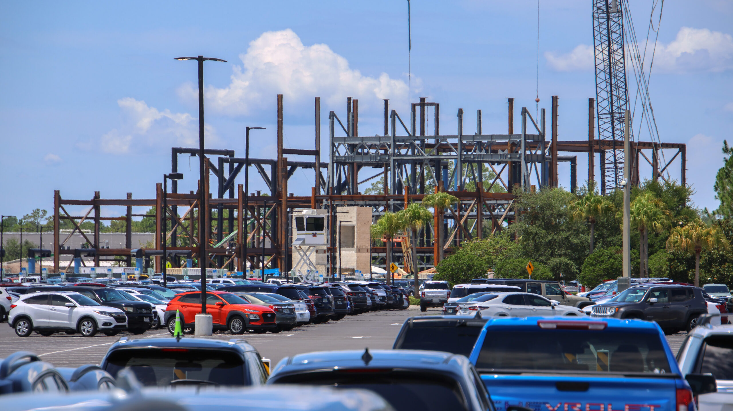 Construction of the upcoming Monsters, Inc. roller coaster continues to reshape the skyline of Disney’s Hollywood Studios, with a towering crane now visible from other areas of the park.