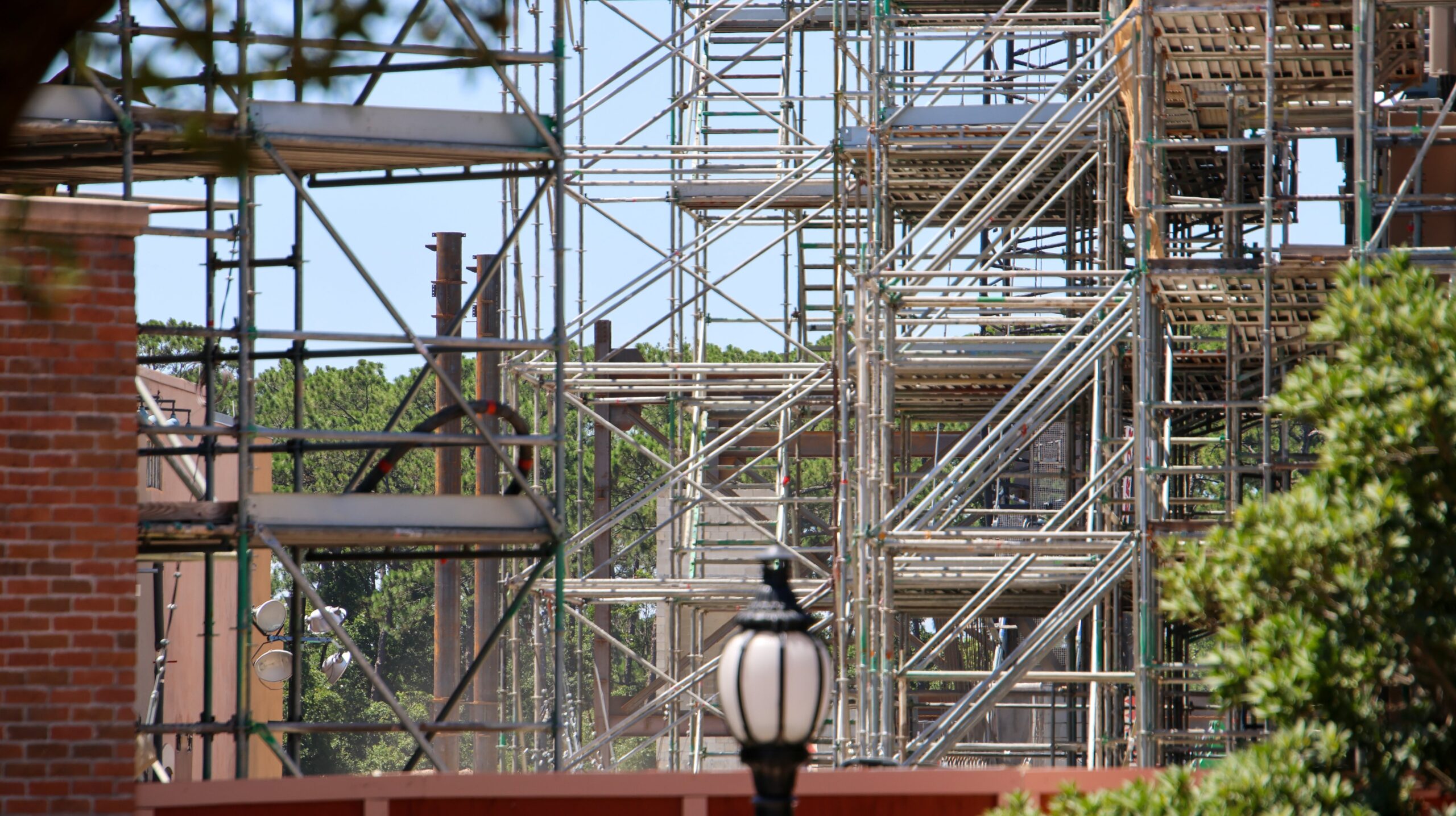 Construction of the upcoming Monsters, Inc. roller coaster continues to reshape the skyline of Disney’s Hollywood Studios, with a towering crane now visible from other areas of the park.