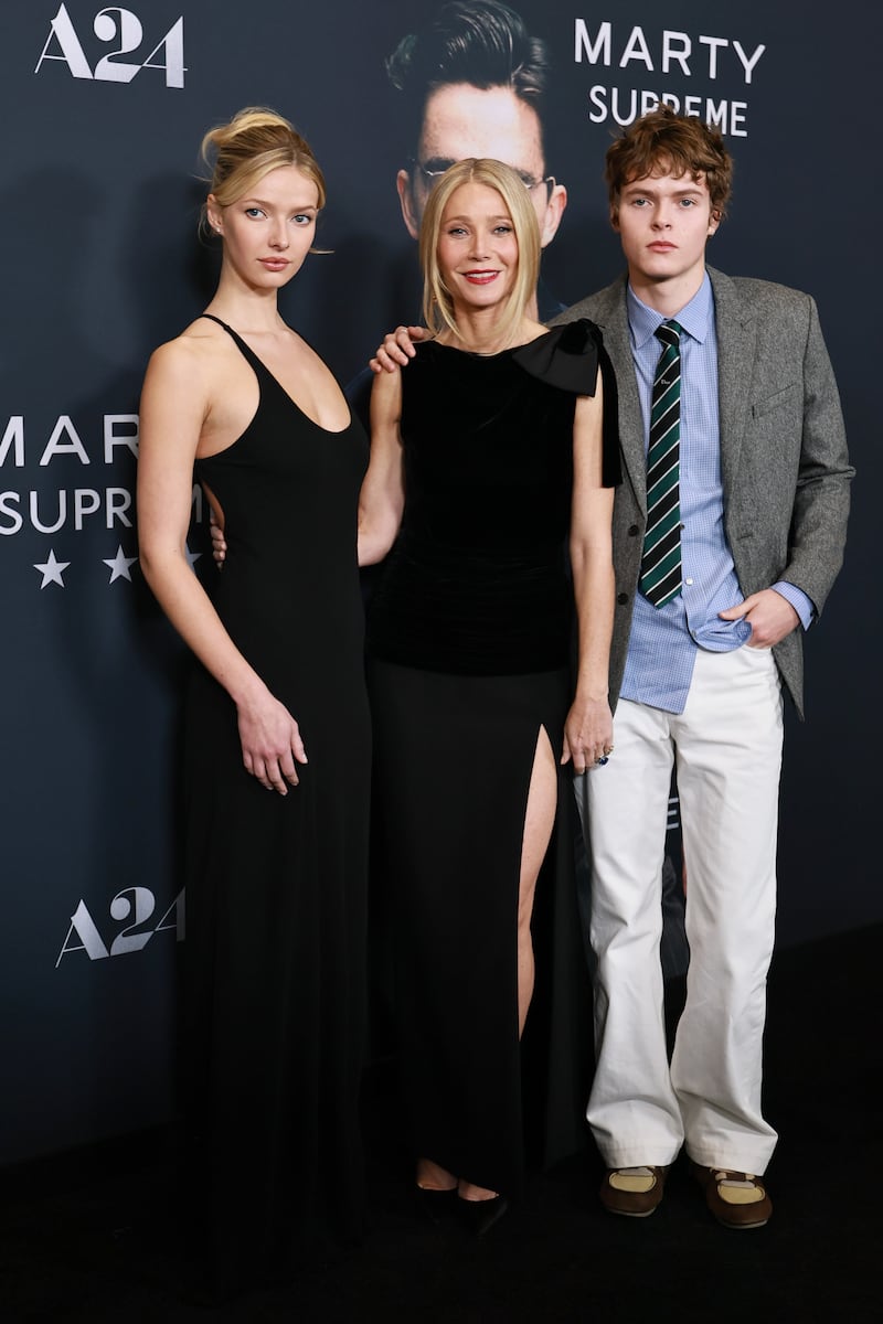Gwyneth Paltrow with her children, Apple and Moses Martin. Pictured here at the “Marty Supreme” New York Premiere on December 16, 2025.