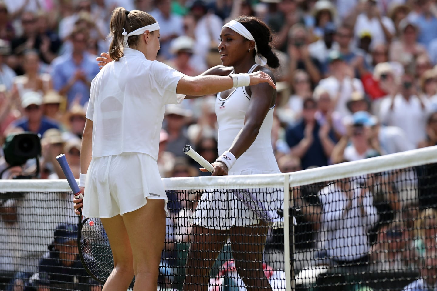 Coco Gauff of the United States congratulates Czech Republic's Karolina Muchova for winning during their women's singles semifinal match Thursday at Wimbledon.