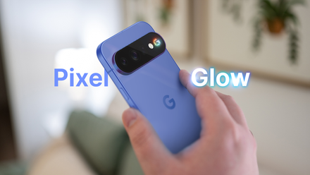 A hand holding a blue Pixel phone with a small multicolor light beside the camera and the words 'Pixel Glow'.
