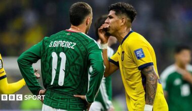 Piero Hincapie of Ecuador covers his mouth while arguing with Santiago Gimenez of Mexico