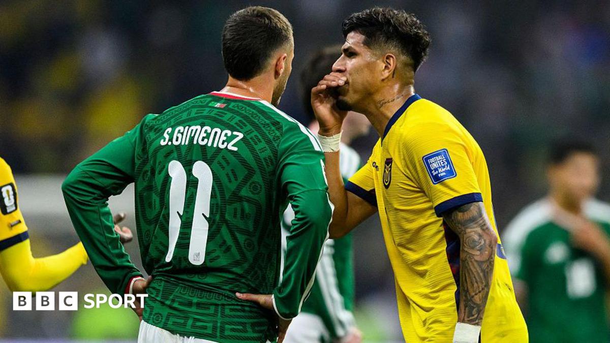 Piero Hincapie of Ecuador covers his mouth while arguing with Santiago Gimenez of Mexico