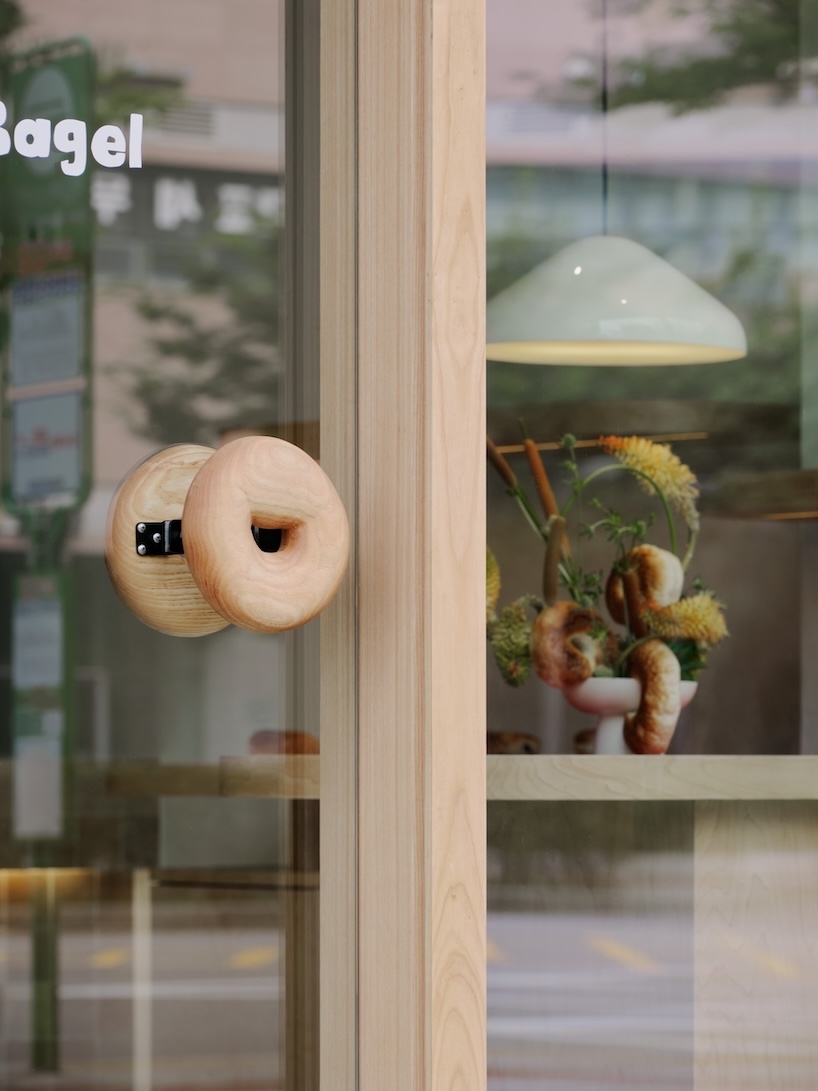 bagel-inspired details and flexible furniture shape seoul bakery’s open interior - 1