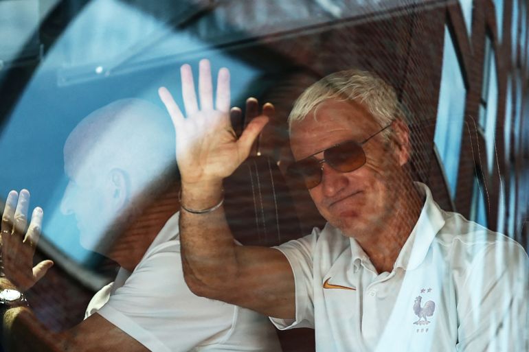France's head coach Didier Deschamps (R) and France's assistant coach Guy Stephan (L) sit in a bus as the team departs from their hotel to travel to Miami on July 16, 2026, in Boston, ahead of the 2026 World Cup bronze medal match between France and England. (Photo by FRANCK FIFE / AFP)